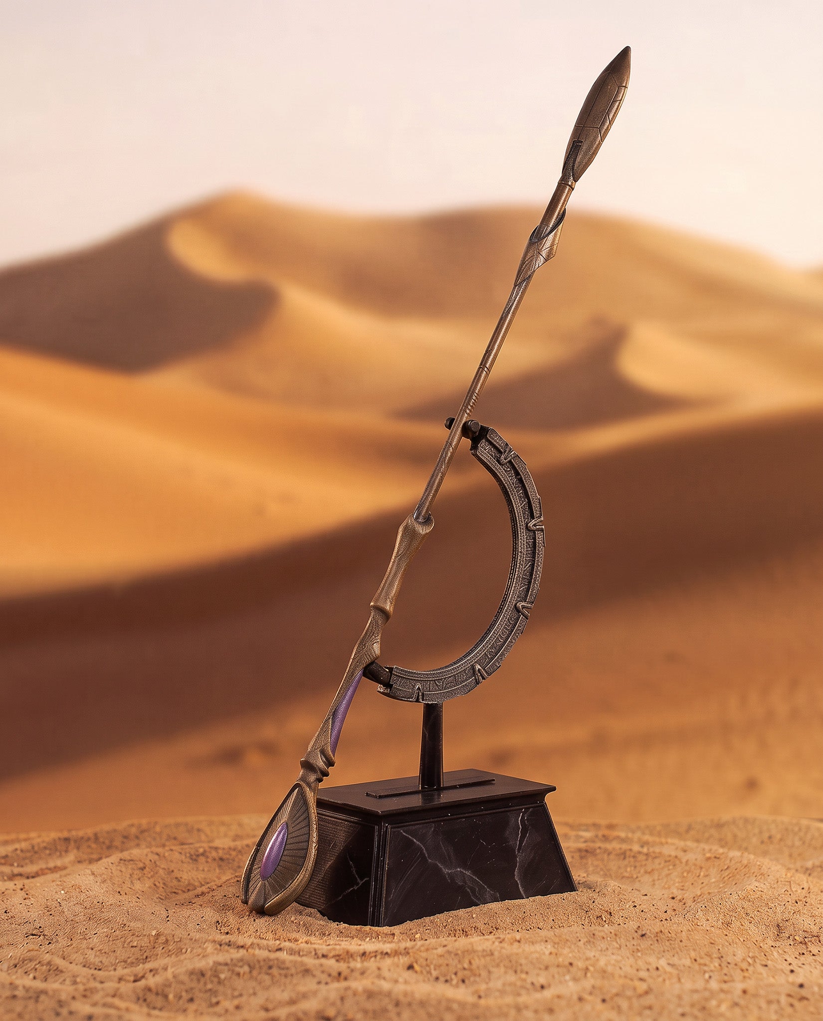 Ma'Tok Staff replica shown with display stand in desert setting